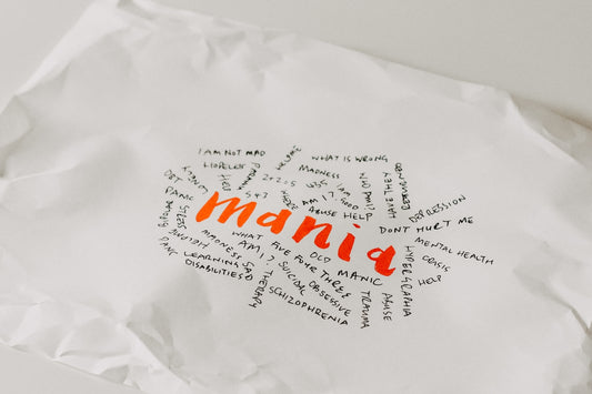 a piece of white paper with orange writing on it