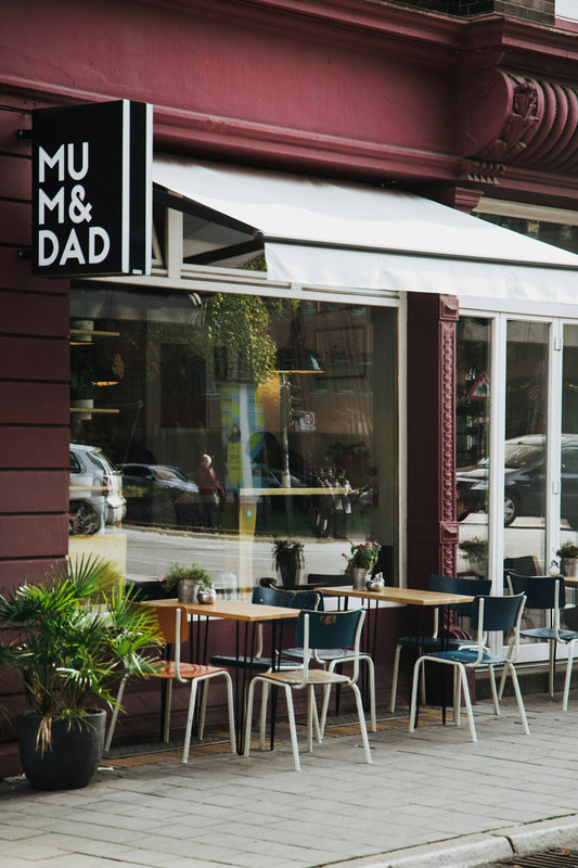 a restaurant with tables and chairs outside