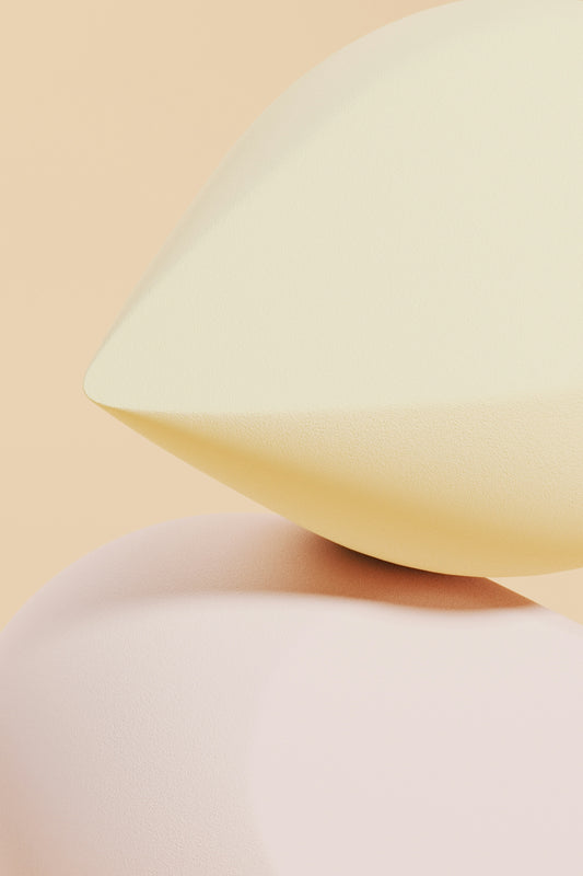 A white pillow sitting on top of a white pillow