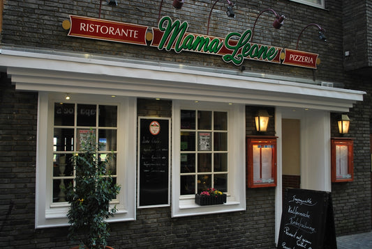 Exterior of ristorante mama leone pizzeria with white windows.